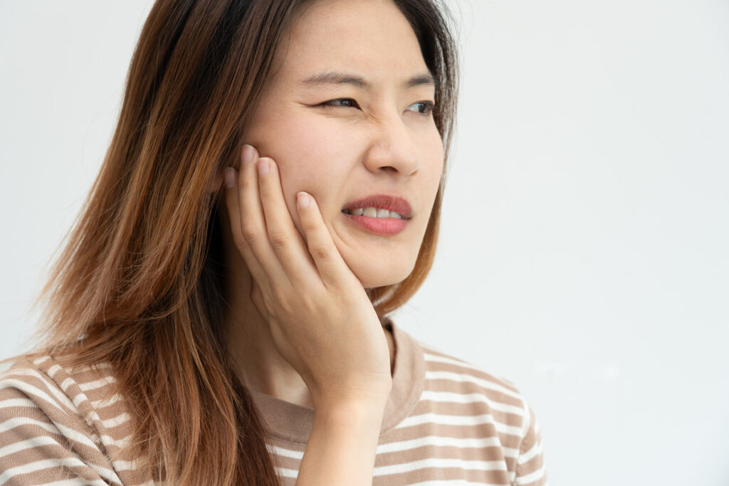 Asian woman feel toothache from gingivitis, female suffer tooth, decay problems, dental care. sensitive tooth, decay problem, bad breath, Gingival Recession, Oral Hygiene instruction, tooth extraction
