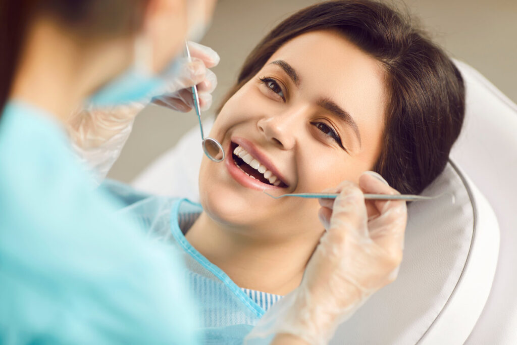 Happy dentist doctor patient showing perfect white toothy smile after whitening, dental treatment procedure result, stomatology or oralcare, working in med clinic for dental health, scheduled cleaning