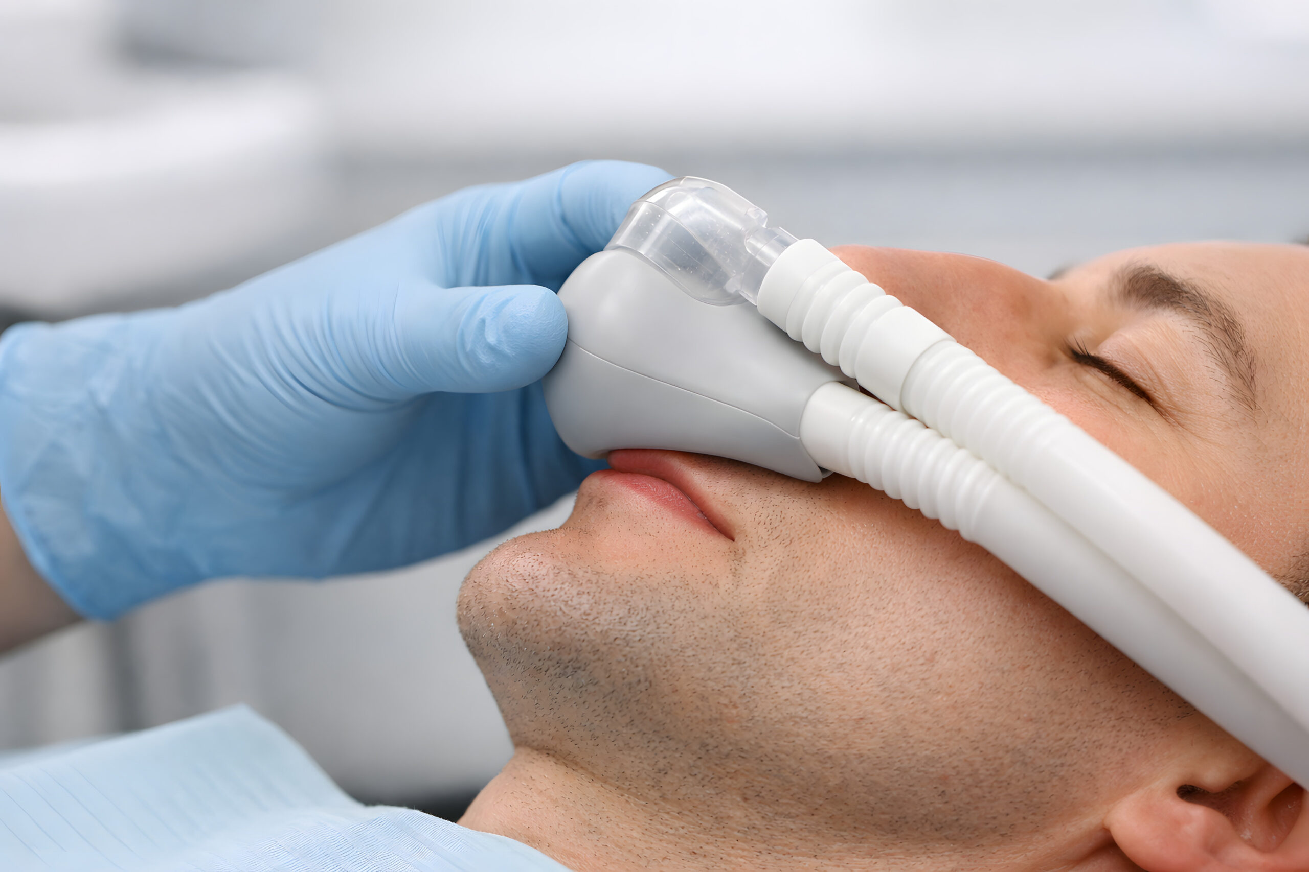 Dental Professional Holding Sedation Mask