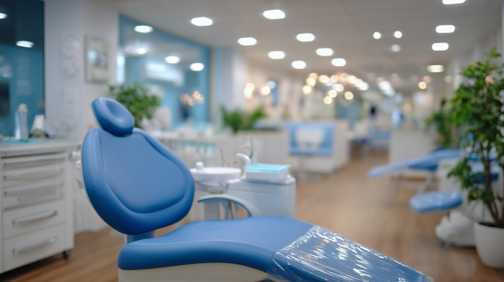 Faceless young child undergoing dental treatment in a modern clinic, pediatric patient reclined in dental chair, dentist tools visible in foreground, bright hygienic environment