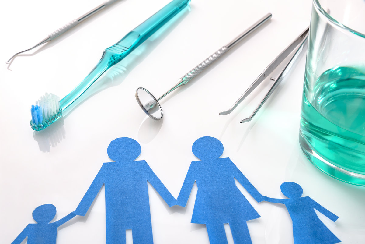 Professional family concept dentist with tools on white table. Horizontal composition. Elevated view